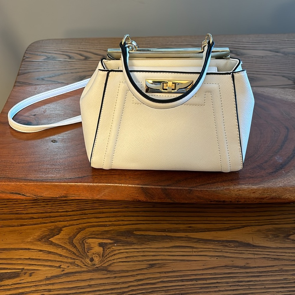 NWOT Aldo white handbag with black trim. Removable Crossbody Strap.